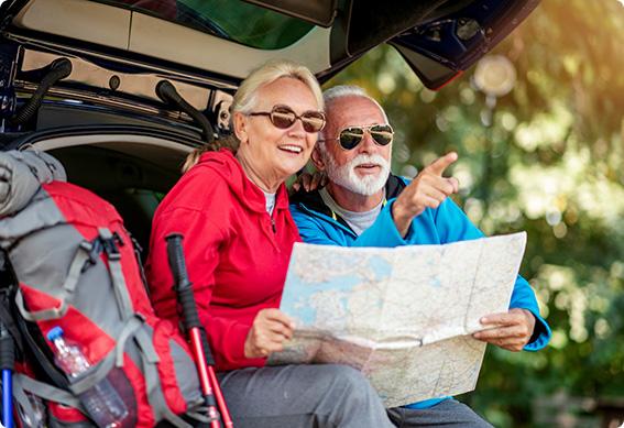 a man and woman holding a map together