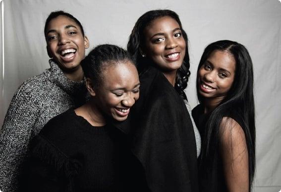 a group of women smiling