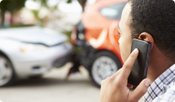 a man on the phone after a car accident