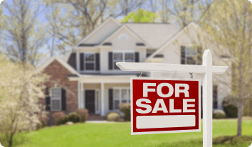 For sale sign in front of a home