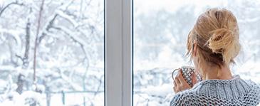 a woman looking out a window