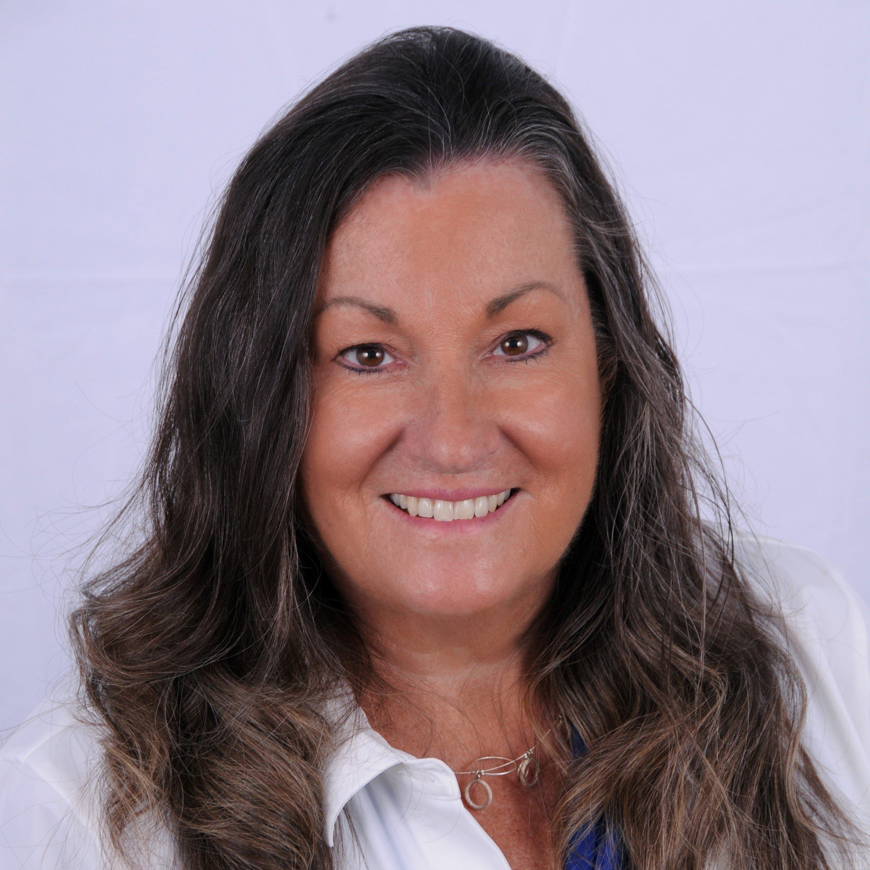 a close-up of a woman smiling