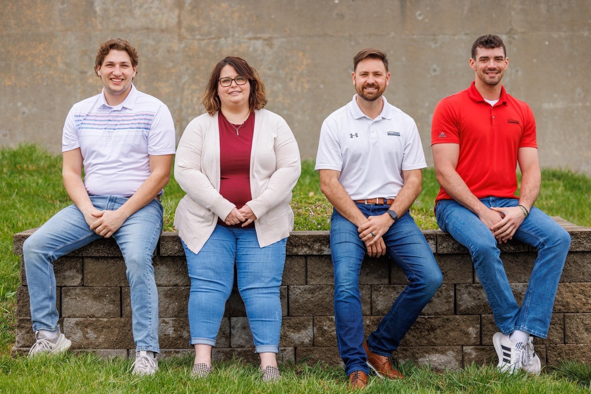 a group of people sitting on a bench