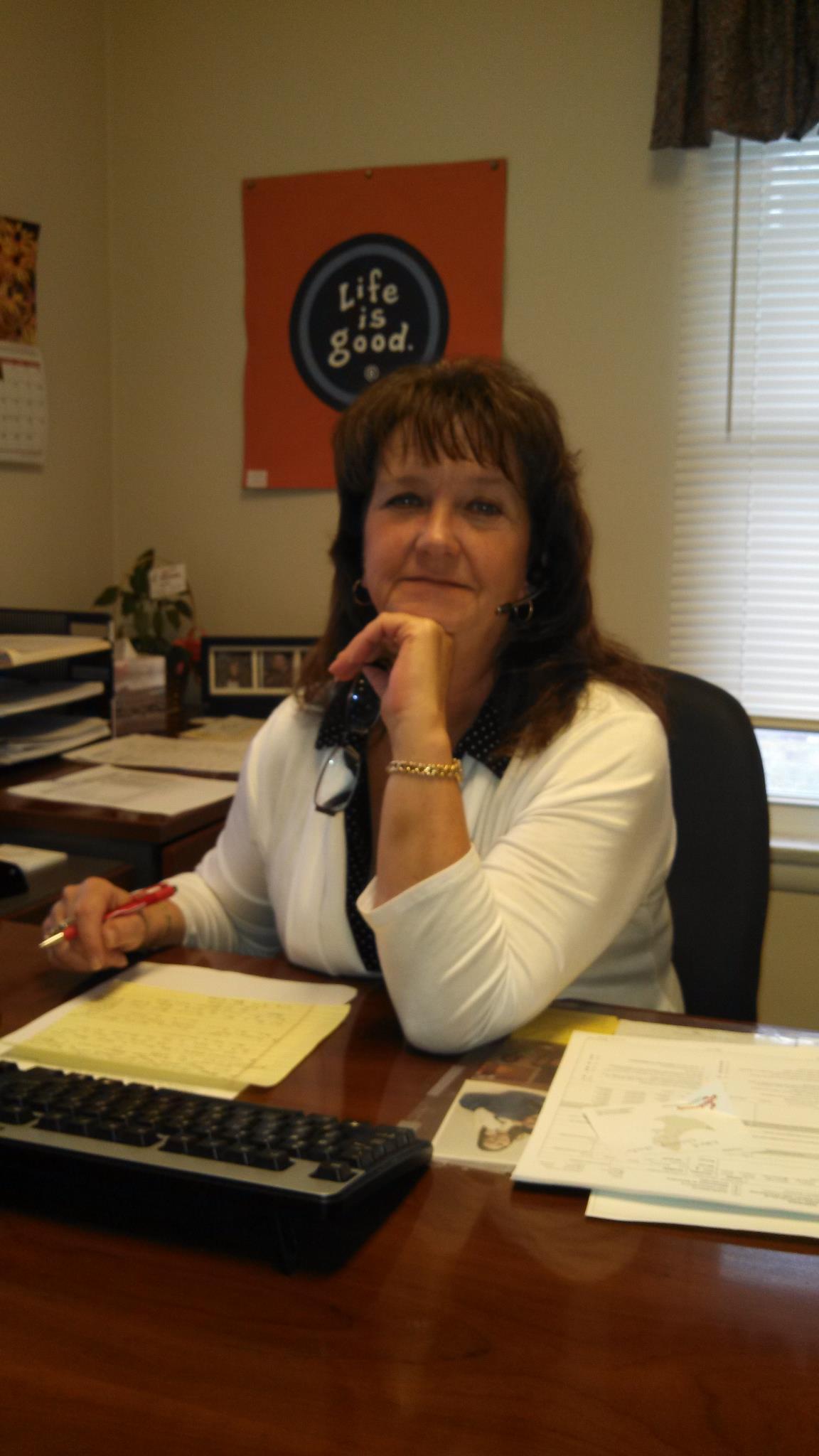 a woman sitting at a desk