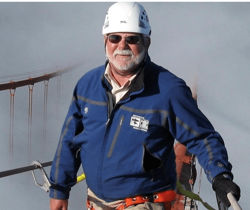 a man wearing a hard hat and sunglasses