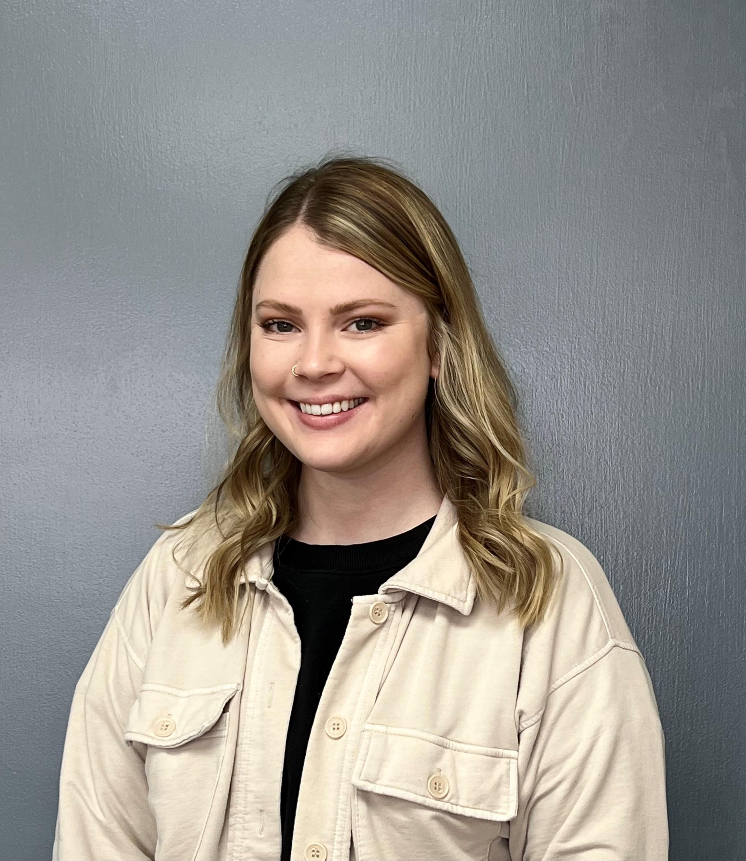 a woman smiling for the camera