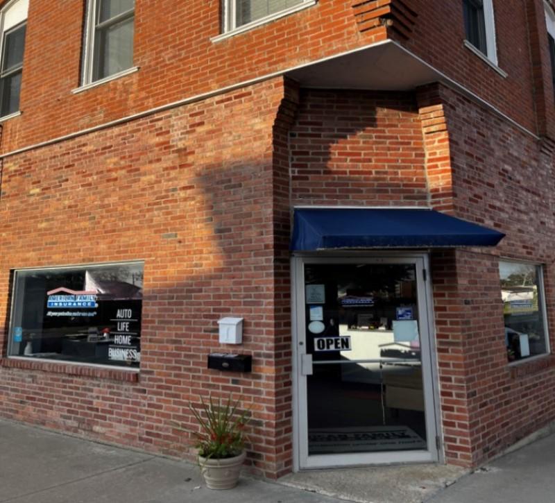 a brick building with a sign on the front