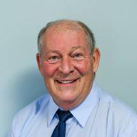 a man wearing a blue shirt and tie