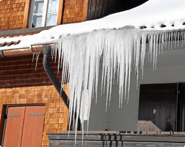 Roof and gutter covered in ice. 