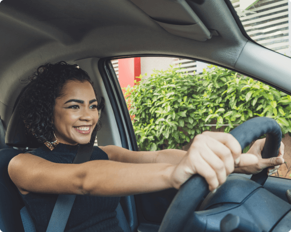 a young woman driving a car