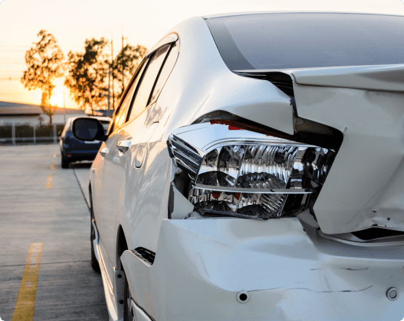 a car with damage in a parking lot