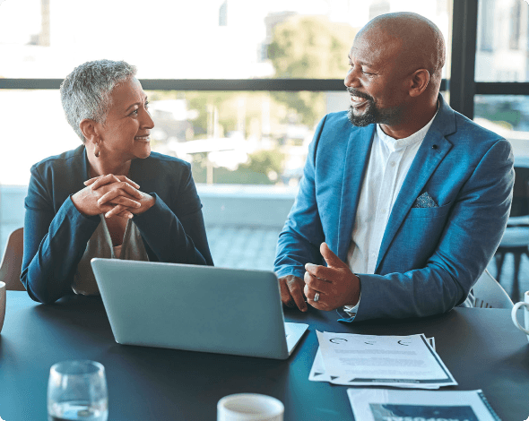 Two talking people smiling and having a conversation