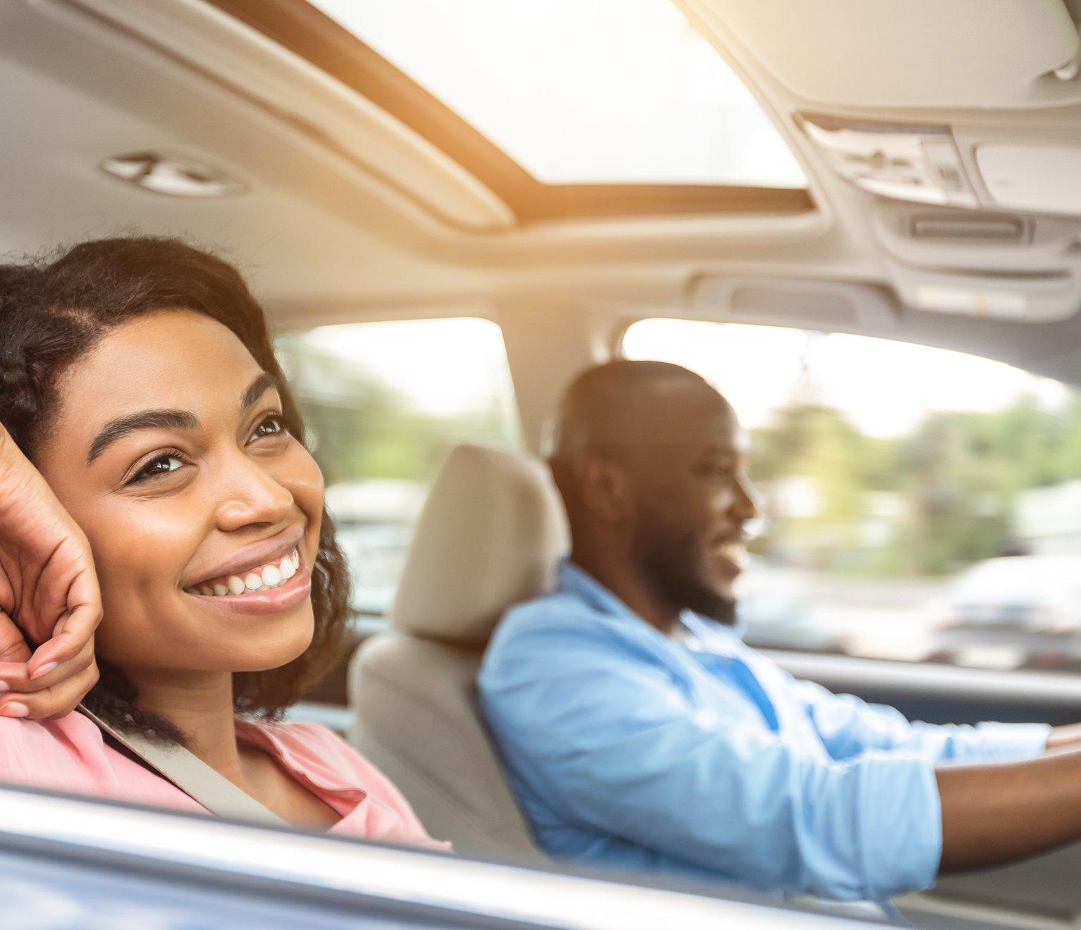 a woman and a man in a car