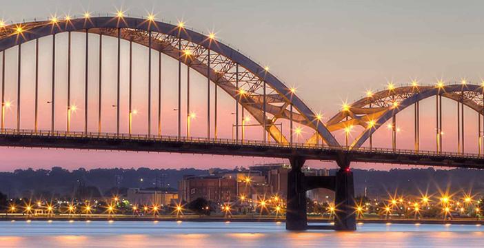 a bridge with lights at night