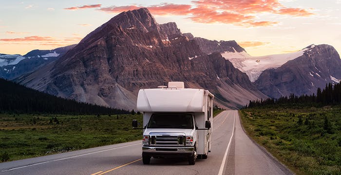 a truck driving down a road